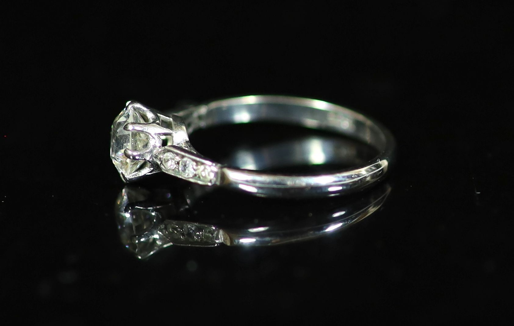 An 18ct white gold and single stone diamond ring